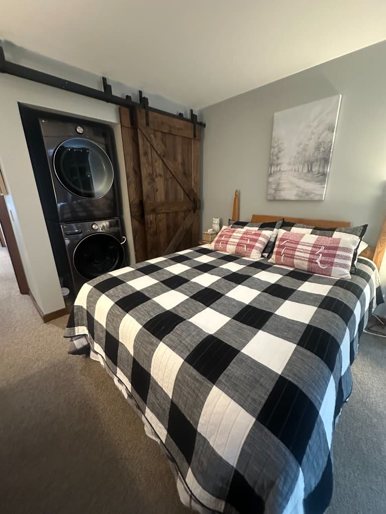 Bedroom with washer and dryer